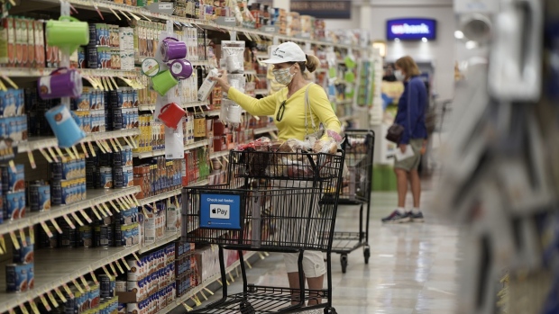A customer wearing a protective mask shops inside an Albertsons Cos. grocery store in San Diego, California, U.S. on Monday, June 22, 2020. Existing shareholders of Albertsons Cos., including Cerberus Capital Management, are seeking as much as $1.3 billion in its U.S. initial public offering, as grocery remains of the the few businesses to get a boost from the pandemic. Photographer: Bing Guan/Bloomberg