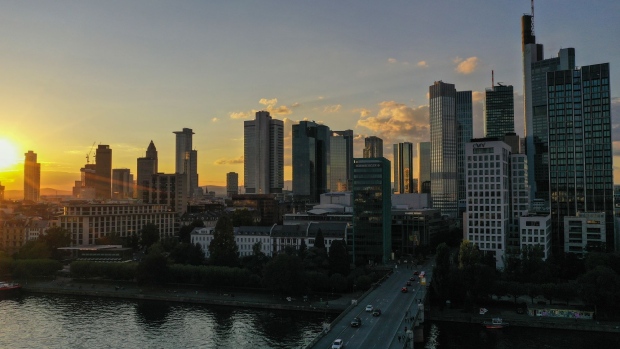 The sun sets over skyscrapers in the financial district in Frankfurt, Germany, on Wednesday, Sept. 2, 2020. Partly thanks to the government’s stimulus program, German activity has staged a strong rebound after collapsing in the second quarter, and companies have turned slightly more optimistic that it will continue to accelerate into next year. Photographer: Alex Kraus/Bloomberg