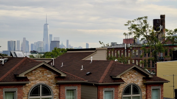 One World Trade Center building in front of residential homes in Jersey City, New Jersey, U.S.,, on Tuesday, Sept. 28, 2021. This year through mid-September, purchase contracts in Hudson County -- also home to Weehawken and Jersey City -- jumped 35% from the same period in 2020, according to data from Otteau Valuation Group. Photographer: Gabby Jones/Bloomberg