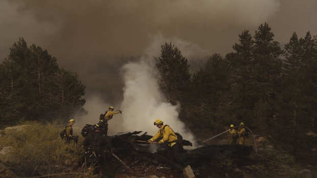 Firefighters work on a spot fire during the Caldor Fire in Kirkwood, California, U.S., on Friday, Sept. 3, 2021. The Caldor Fire, which ignited Aug. 14 has burned at least 212,907 acres, or more than 332 square miles, and containment stood at 29% as of Friday, Cal Fire said in its morning update. Photographer: Eric Thayer/Bloomberg