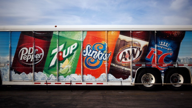 Signage is displayed on a delivery truck outside the Dr. Pepper Snapple Group Inc. bottling plant in Irving, Texas, U.S., on Tuesday, Oct. 25, 2016. Dr. Pepper Snapple Group Inc. is scheduled to release earnings figures on October 27.