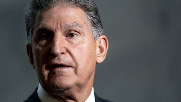 Senator Joe Manchin, a Democrat from West Virginia, speaks to members of the media at the Hart Senate Office building in Washington, D.C., U.S., on Wednesday, Oct. 6, 2021. Democrats and Republicans must decide in the next day or two how far to take their deadlock over the U.S. debt limit, which is pushing the country perilously close to a catastrophic default.