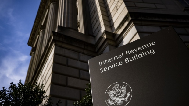 Signage outside the Internal Revenue Service (IRS) headquarters in Washington, D.C., U.S., on Friday, March 19, 2021. The IRS is delaying the April 15 tax-filing deadline to May 17, giving taxpayers an additional month to file returns and pay any outstanding levies. Photographer: Samuel Corum/Bloomberg