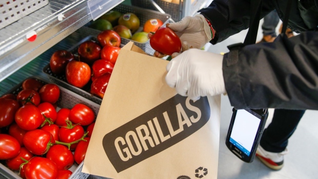 A worker fulfills orders at a Gorillas dark store in London.