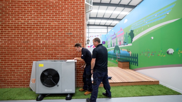 Engineers work on installing an Ecoforest heat pump at the Octopus Energy Ltd.'s training and R&D centre in Slough, U.K., on Tuesday, Sept. 28, 2021. Octopus, backed by Al Gore's sustainability fund, is helping teach the plumbers to install heat pumps that will play a pivotal role in the U.K.’s strategy to have net-zero emissions by 2050.