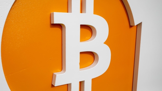 Bitcoin signage during the Bitcoin 2021 conference in Miami, Florida, U.S., on Friday, June 4, 2021. The biggest Bitcoin event in the world brings a sold-out crowd of 12,000 attendees and thousands more to Miami for a two-day conference.