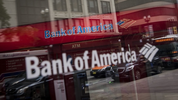 Vehicles are reflected in the window of a Bank of America Corp. branch in Chicago, Illinois, U.S.