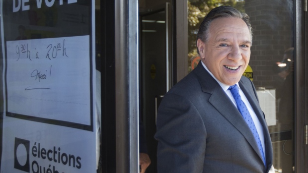 Francois Legault, leader of the Coalition Avenir Quebec party, exits a polling station after casting a ballot in L'Assomption, Quebec, Canada, on Monday, Oct. 1, 2018. Quebeckers go to the polls Monday to decide whether to try a new political party for the first time in nearly four decades, with the province's dairy industry suddenly under threat.