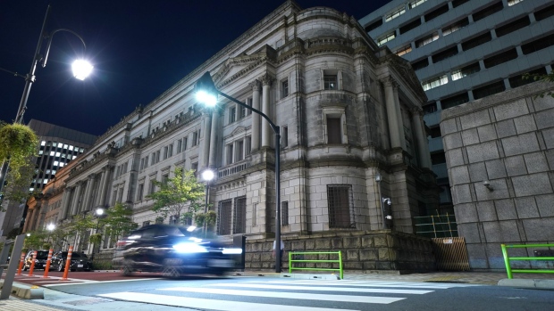 The Bank of Japan (BOJ) headquarters at night in Tokyo, Japan, on Sept. 27, 2021. The Bank of Japan will release its quarterly Tankan business sentiment survey on Oct. 1. Photographer: Toru Hanai/Bloomberg