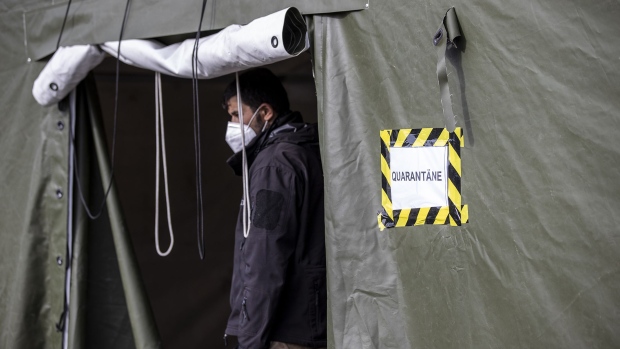 A quarantine tent stand near the entrance to a holding facility in Eisenhuttenstadt, Germany, on Oct. 6, 2021. Police have been detaining a growing number of illegal migrants, many of them from Iraq, who have been arriving at the German border from Poland, most of them most likely having arrived previously in Belarus before heading onwards.
