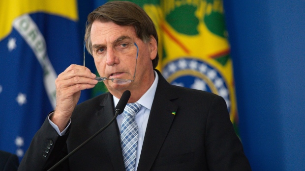 Jair Bolsonaro, Brazil’s president, speaks during a bill signing ceremony at the Planalto Palace in Brasilia, Brazil, on Wednesday, March 10, 2021. Bolsonaro said Brazil will have more than 400m doses of vaccines available by the end of this year.