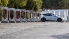 A vehicle at a Tesla Supercharger station in Vallejo, California, U.S., on Tuesday, Oct. 19, 2021. Tesla Inc. is expected to release earnings figures on October 20. Photographer: David Paul Morris/Bloomberg