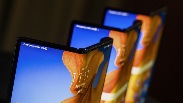 Mate Xs folding smartphones, manufactured by Huawei Technologies Co., stand on display at a launch event in London, U.K., on Tuesday, Feb. 18, 2020. The Chinese company on Monday announced a second-generation version of its Mate X folding phone, which up to now has been sold mostly in its home country. Photographer: Chris Ratcliffe/Bloomberg