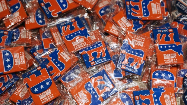 Buttons featuring the Democratic donkey and Republican elephant mascots sit at an election watch party organized by the American Chamber of Commerce in Hong Kong, China, on Wednesday, Nov. 9, 2016. Republican Donald Trump and Democrat Hillary Clinton ticked off easy and expected wins as states began closing polls with results from several crucial battlegrounds still outstanding. Photographer: Anthony Kwan/Bloomberg