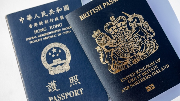 A copy of the Hong Kong Special Administrative Region (HKSAR) passport arranged in Hong Kong, China, on Saturday, Jan. 30, 2021. Prime Minister Boris Johnson estimates about 300,000 Hong Kong citizens will take advantage of a new visa route to leave the former British colony and settle in the U.K., despite nearly three million people being eligible. Photographer: Paul Yeung/Bloomberg