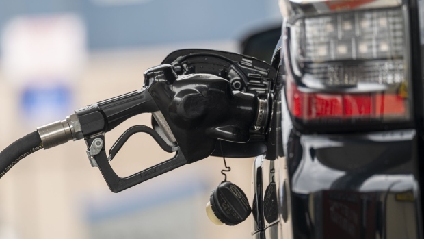 A fuel nozzle in a car at a gas station in San Francisco, California, U.S., on Thursday, Oct. 21, 2021. American drivers will continue to face historically high fuel prices as gasoline demand surged to the highest in more than a decade. Photographer: David Paul Morris/Bloomberg