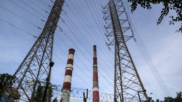 Electricity pylons and chimneys at the Tata Power Co. Trombay Thermal Power Station in Mumbai, India, on Wednesday, Oct. 6, 2021. India is grappling with an escalating crisis as stockpiles of coal, the fuel used to generate about 70% of the nation’s electricity, dwindle to the lowest in years just as power demand is set to surge.