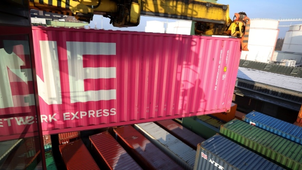 A gantry crane maneuvers an Ocean Network Express Holdings Ltd. (ONE) shipping container at Behala inland port in Berlin, Germany, on Tuesday, Jan. 26, 2021. A global shortage of shipping containers that's sent ocean freight rates skyrocketing shows signs of easing, according to an index that tracks the steel boxes used to transport 90% of the global trade in goods. Photographer: Liesa Johannssen-Koppitz/Bloomberg