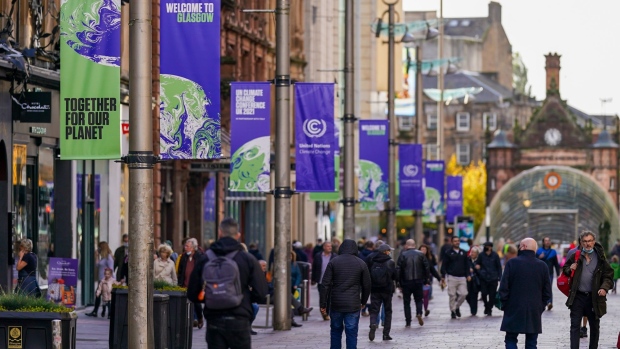 Banners advertising the upcoming COP26 climate talks line a precinct in Glasgow, U.K., on Wednesday, Oct. 20, 2021. Glasgow will welcome world leaders and thousands of attendees for the crucial United Nations summit on climate change in November. Photographer: Ian Forsyth/Bloomberg