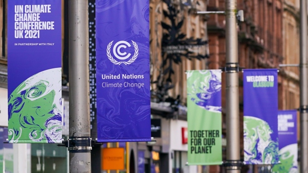 Banners advertising the upcoming COP26 climate talks in Glasgow, U.K., on Wednesday, Oct. 20, 2021. Glasgow will welcome world leaders and thousands of attendees for the crucial United Nations summit on climate change in November. Photographer: Ian Forsyth/Bloomberg