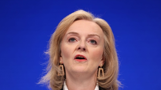 Liz Truss, U.K. foreign secretary, speaks on the first day of the annual Conservative Party conference in Manchester, U.K., on Sunday, Oct. 3, 2021. In a quirk of timing, the Conservative conference is bookended by the phasing out of two major support measures credited with staving off an unemployment crisis and limiting the numbers falling into poverty during the pandemic. Photographer: Hollie Adams/Bloomberg