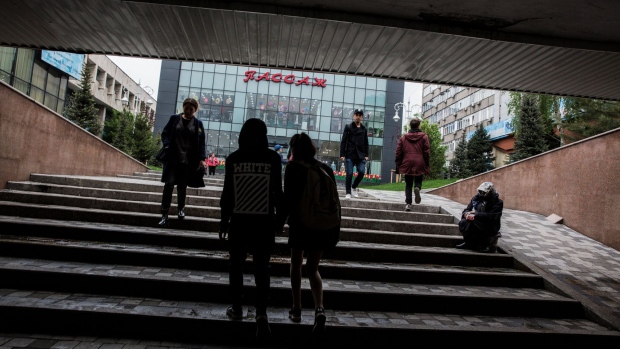 Pedestrians walk through an underpass in Almaty, Kazakhstan, on Thursday, April 26, 2018. By juggling its reserves to reduce the pain of negative interest rates in Europe and Japan last year, the central bank of Kazakhstan has set itself up to reap the benefits of a rallying dollar. Photographer: Taylor Weidman/Bloomberg