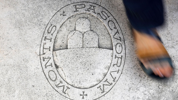 A logo on the floor at the entrance of a Banca Monte dei Paschi di Siena SpA bank branch in Siena, Italy, on Monday, Sept. 20, 2021. After more than 500 years as a pillar of prosperity in the hills of Tuscany and a decade or so as a byword for dysfunction, Banca Monte dei Paschi di Siena SpA appears to be entering the final chapter of its history. Photographer: Alessia Pierdomenico/Bloomberg