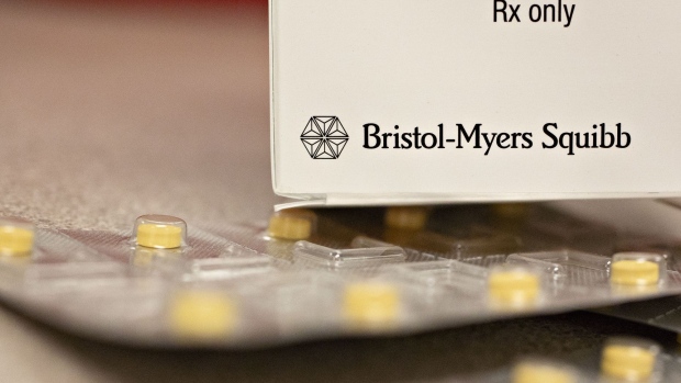 Bristol-Myers Squibb Co. signage is displayed on a prescription medicine box arranged for a photograph at a pharmacy in Princeton, Illinois, U.S., on Monday, Jan. 7, 2019. Bristol-Myers Squibb agreed to acquire Celgene Corp. in a record-sized $74 billion deal that will unite two drugmakers battling for advantage in a crowded market for innovative cancer treatments. Photographer: Daniel Acker/Bloomberg