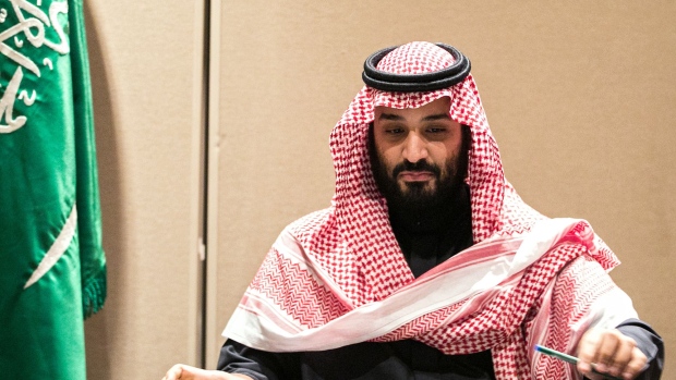 Mohammed bin Salman, Saudi Arabia's crown prince, puts down a pen after signing an agreement with SoftBank Group Corp. chairman Masayoshi Son, not pictured, in New York, U.S., on Tuesday, March 27, 2018. Saudi Arabia has signed a memorandum of understanding with SoftBank for a $200 billion solar power project in the kingdom, calling it the single largest of its kind in the world.