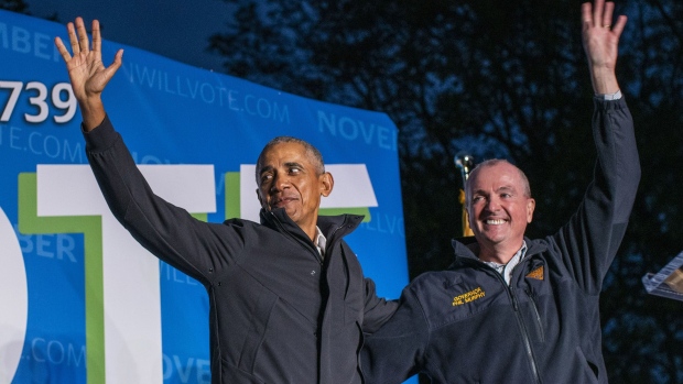 NEWARK, NJ - OCTOBER 23: Former U.S. President Barack Obama (L) and New Jersey Governor Phil Governor Murphy wave at attendees after taking part in an early vote rally on October 23, 2021 in Newark, New Jersey. People are heading to the polls in New Jersey for early voting as Murphy faces Republican challenger Jack Ciattarelli. (Photo by Eduardo Munoz Alvarez/Getty Images)