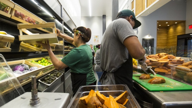 Workers prepare food inside a Sweetgreen Inc. restaurant in Boston, Massachusetts, U.S., on Tuesday, Oct. 24, 2017. The fast casual dining chain Sweetgreen was founded in 2007 by three classmates from Georgetown University, and has expanded from its Washington roots to more than 80 locations nationally. Photographer: Adam Glanzman/Bloomberg