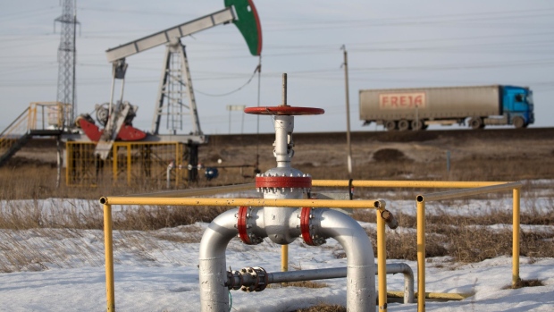 An oil pumping jack, also known as "nodding donkey", operated by Tatneft PJSC, stands in an oilfield near Almetyevsk, Tatarstan, Russia, on Wednesday, March 11, 2020. Saudi Aramco plans to boost its oil-output capacity for the first time in a decade as the world’s biggest exporter raises the stakes in a price and supply war with Russia and U.S. shale producers. Photographer: Andrey Rudakov/Bloomberg