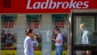 A Ladbrokes betting shop, operated by Entain Plc, in London, U.K., on Wednesday, Sept. 22, 2021. Entain shares jumped after DraftKings Inc. offered to acquire the U.K. gambling company for about $22.4 billion, as a surge in sports betting helps drive deal activity across the industry.