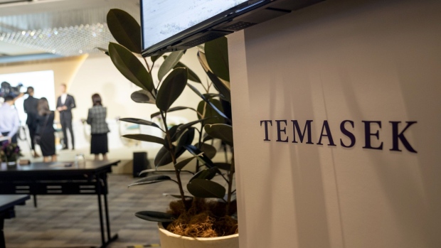 Signage for Temasek Holdings Pte. is displayed during a news conference following the company's annual review in Singapore, on Tuesday, July 9, 2019. Temasek held onto gains in its portfolio amid global trade uncertainties after selling S$28 billion ($20.6 billion) of holdings as U.S. equity markets hit record highs and its unlisted assets outperformed. Photographer: Bryan van der Beek/Bloomberg