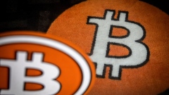 A bitcoin logo on the carpet of a bitcoin automated teller machine (ATM) kiosk in Barcelona, Spain, on Tuesday, Feb. 23, 2021. Bitcoin climbed, aided by supportive comments from Ark Investment Management’s Cathie Wood and news that Square Inc. boosted its stake in the cryptocurrency. Photographer: Angel Garcia/Bloomberg