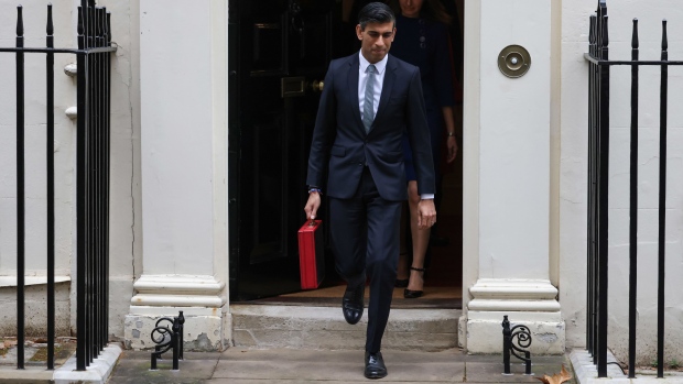 Rishi Sunak departs from number 11 Downing Street with his ministerial dispatch box on his way to present his spending review in Parliament in London, on Oct. 27. Photographer: Hollie Adams/Bloomberg