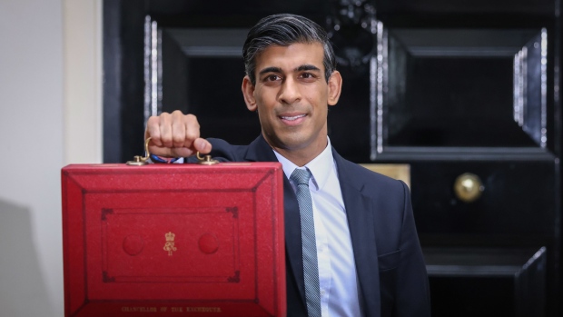Rishi Sunak, U.K. chancellor of the exchequer, departs from number 11 Downing Street with his ministerial dispatch box on his way to present his spending review in Parliament in London, U.K., on Wednesday, Oct. 27, 2021. Sunak is set to lay out the government's autumn budget with new forecasts from the Office of Budget Responsibility.