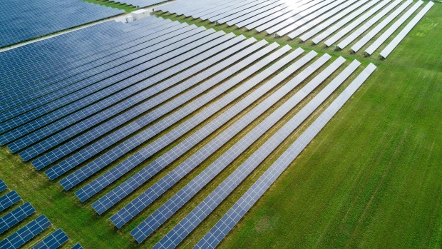 Solar panels stand in this aerial photograph taken above the Enbridge Inc. Sarnia Solar Farm in Sarnia, Ontario, Canada, on Friday, July 21, 2017. The Sarnia Solar Farm, which became fully operational in the fall of 2010, was at the time one of the largest photovoltaic solar farms in the world. It was also Enbridge's first ever foray into solar energy, costing $400 million. Photographer: James MacDonald/Bloomberg