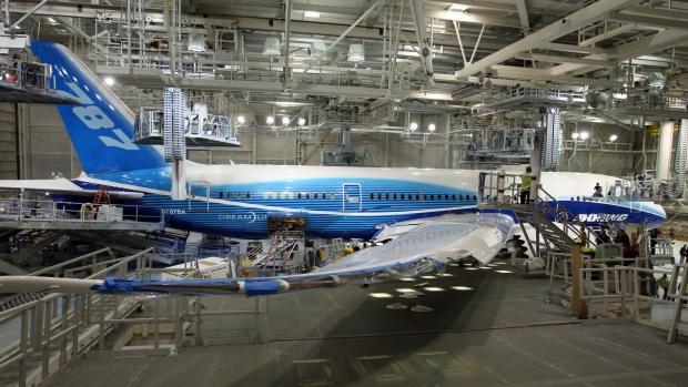 A Boeing Co. 787 Dreamliner airplane sits in the paint hangar at the company's manufacturing plant in Everett, Washington, U.S., on Thursday, April 30, 2009. Boeing Co.'s delayed 787 Dreamliner has received the Federal Aviation Administration's approval for about 45 percent of the certification needed to deliver the plane as scheduled next year, the program's chief engineer said yesterday. The Dreamliner is currently about two years behind schedule. Photographer: KEVIN P.CASEY/Bloomberg News