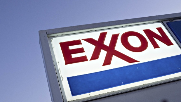 Signage is displayed at an Exxon Mobil Corp. gas station in Falls Church, Virginia, U.S., on Tuesday, April 28, 2020. Exxon is scheduled to released earnings figures on May 1. Photographer: Andrew Harrer/Bloomberg