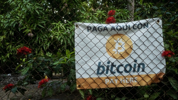 Bitcoin signage outside a shop in El Zonte, El Salvador, on Monday, June 14, 2021. El Salvador has become the first country to formally adopt Bitcoin as legal tender after President Nayib Bukele said congress approved his landmark proposal. Photographer: Cristina Baussan/Bloomberg