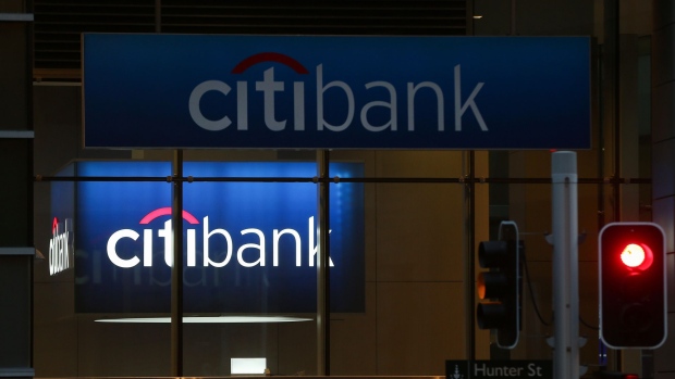 A traffic light stands in front of a Citigroup Inc. Citibank branch in Sydney, Australia, on Friday, June 1, 2018. Australia's banking industry faces an unprecedented criminal prosecution as Australia & New Zealand Banking Group Ltd. and two of its underwriters, Deutsche Bank AG and Citigroup, brace for cartel charges over a A$2.5 billion ($1.9 billion) share sale. Photographer: Brendon Thorne/Bloomberg
