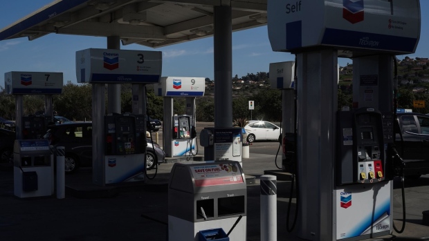 Drivers refuel their vehicles at a Chevron gas station in San Diego, California, U.S., on Thursday, Oct. 21, 2021. American drivers will continue to face historically high fuel prices as gasoline demand surged to the highest in more than a decade. Photographer: Bing Guan/Bloomberg