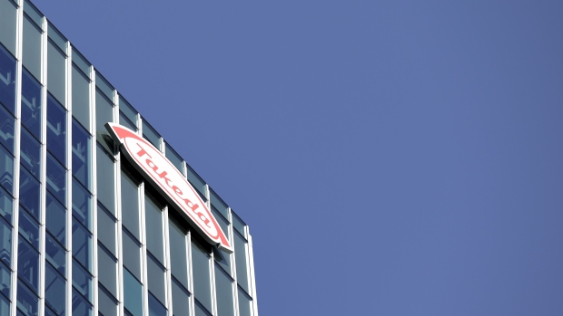 The Takeda Pharmaceutical Co. logo is displayed atop the company's global headquarters in Tokyo, Japan on Monday, Jan. 7, 2019. Takeda is looking at divesting businesses outside of Japan that are non-performing and non-core, Takeda Chief Executive Officer Christophe Weber said at a news conference today. Photographer: Kiyoshi Ota/Bloomberg