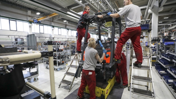 Employees fit a windshield to the cabin of a Linde H 20-35 forklift truck at the Linde Material Handling GmbH factory, a unit of Kion Group AG, in Aschaffenburg, Germany, on Tuesday, Nov. 19, 2019. Companies operating in the U.K. fear that if Britain crashes out of the European Union without an agreement it could create shortages and they are stockpiling goods, feeding demand for Kion's forklift trucks, according to Chief Executive Officer Gordon Riske.