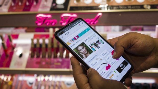 An employee demonstrates the Nykaa application at one of the company's stores in New Delhi, India on Saturday, July 30, 2021. Nykaa has grown into India's top e-commerce site for beauty products, with the endorsement of Bollywood stars and a fervent following among twenty-somethings. The startup filed preliminary documents on Aug. 2 for an initial public offering, which Bloomberg News has reported could value the business at more than $4 billion.