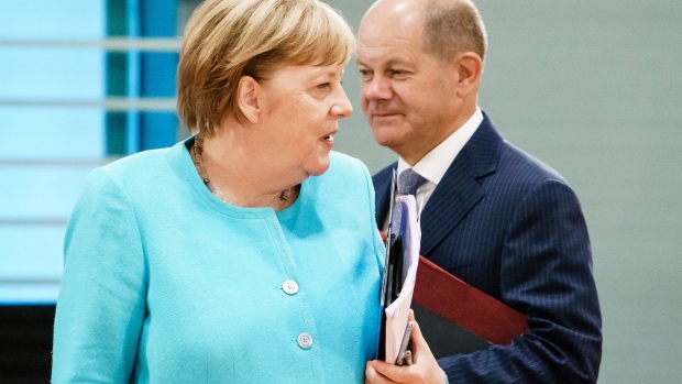 BERLIN, GERMANY - AUGUST 19: German Chancellor Angela Merkel (R) and German Minister of Finance Olaf Scholz attend a cabinet meeting at the German chancellery on August 19, 2020 in Berlin, Germany. (Photo by Clemens Bilan Pool/Getty Images)