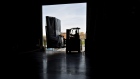 A worker uses a forklift to move packages at a facility in Baltimore. Photographer: Andrew Harrer/Bloomberg