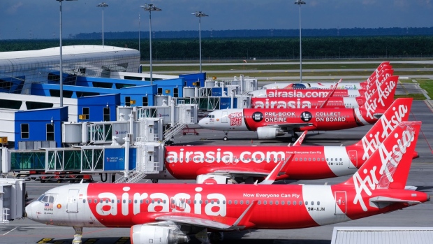 AirAsia Group Bhd. aircraft stand on the tarmac at Kuala Lumpur International Airport 2 (KLIA 2) in Sepang, Selangor, Malaysia, on Monday, Aug. 24, 2020. AirAsia is scheduled to report its quarterly results on Aug. 28. Photographer: Samsul Said/Bloomberg