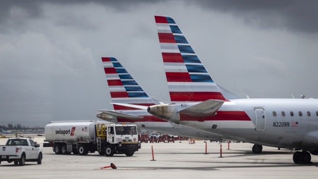Tails fins of passenger aircraft operated by American Airlines Group Inc. at Miami International Airport in Miami, Florida, U.S., on Wednesday, June 16, 2021. Daily U.S. air travelers exceeded 2 million for the first time since the coronavirus pandemic began, reaching almost three-quarters of the volume recorded on the same day in 2019, according to the Transportation Security Administration. Photographer: Eva Marie Uzcategui/Bloomberg